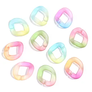Close-up detail of colorful gradient acrylic open jump rings, DIY jewelry chain accessories.