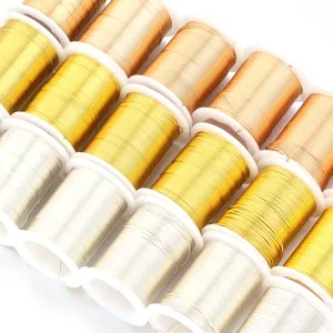 Detailed close-up shot of colorful craft wire spools, metallic copper and silver beading wire.