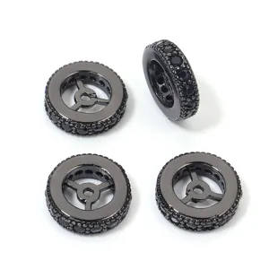 Detailed view of copper wheel spacer beads set with black cubic zirconia for DIY jewelry making.