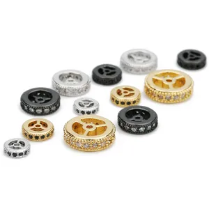 Detailed view of copper wheel spacer beads inlaid with shiny cubic zirconia for DIY bracelets.