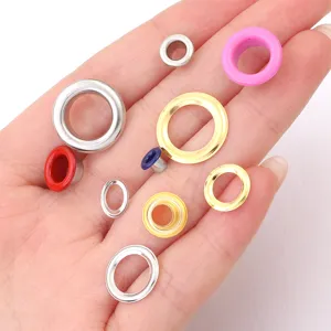 Colorful metal eyelets grommets for garments bags shoes crafts and leather working detail view