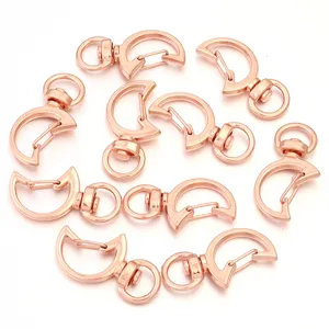 Detail shot of rose gold moon shaped swivel snap hooks for DIY handmade keychains and accessories.
