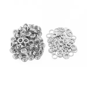 Metal eyelets and washers detail shot, silver grommets for garments and leather crafts.