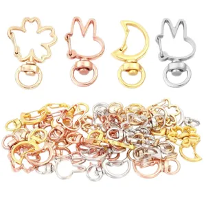 Zinc alloy DIY keychain clips, assorted cute shapes like moon and rabbit in gold silver colors.