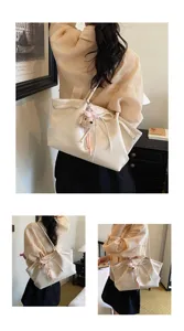 Korean style retro large capacity tote bag with cute plush bear pendant for women.