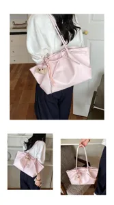 Pink tote bag detail shot showing large capacity, stylish bow knot design and cute bear pendant.