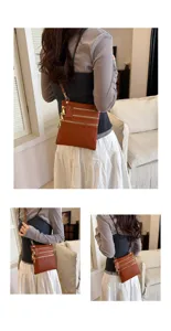 Women's brown leather crossbody shoulder bag with multi zippers, stylish casual phone bag.