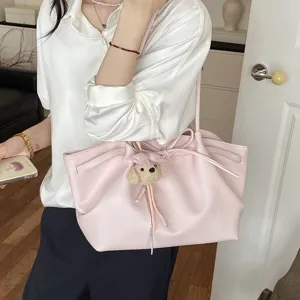Pink tote bag with cute puppy pendant, large capacity soft leather shoulder bag for women daily.