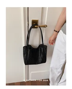 Black woven leather shoulder bag, trendy hollow hobo tote for women, elegant everyday purse.