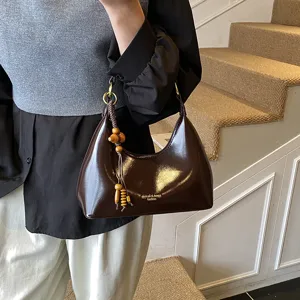 Brown patent leather hobo underarm bag with cute wooden bead charm for women fashion chic style