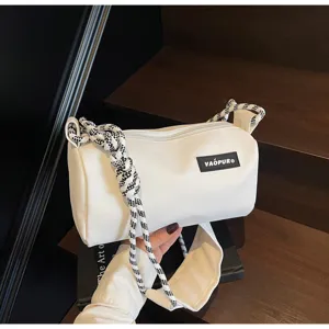 White waterproof cylindrical shoulder bag with braided strap for daily casual fashion use.