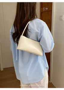 Minimalist white PU leather shoulder bag, chic underarm bag for women and stylish daily commute.