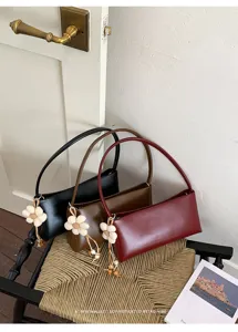 Minimalist retro PU leather shoulder bag chic baguette handbag with flower charm for women