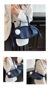 Women soft leather shoulder bag, stylish pleated cloud handbag with cute plush ball pendant.
