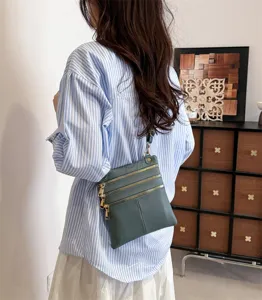 Women multi-zipper leather crossbody bag, casual stylish shoulder bag with metal hardware.