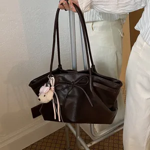 Korean retro fashion women's large capacity tote shoulder bag with bow and cute plush pendant.