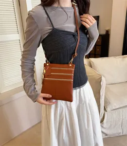 Stylish women leather crossbody bag and phone pouch with multiple zip pockets for daily use.