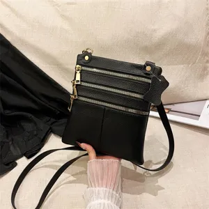 Stylish women leather crossbody bag with multiple zippers, perfect phone shoulder bag for daily use.