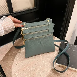 Multi-zipper leather crossbody bag for women, stylish daily shoulder bag with strap.