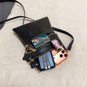 Black PU leather multi-zipper crossbody phone bag, flat lay main view displaying capacity.