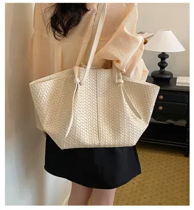Woven tote bag for women, large capacity shoulder bag with stylish minimalist design.