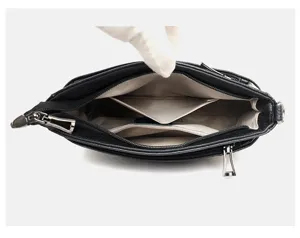 Detailed interior view of genuine leather women handbag, multiple compartments and zip pocket.