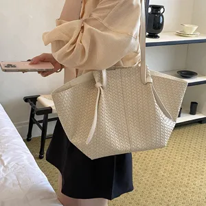 Woven tote bag for women, stylish large capacity single shoulder handbag in chic beige design.