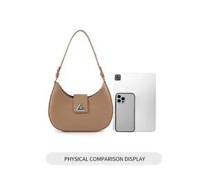 Minimalist brown crescent shoulder bag, stylish underarm bag with metal clasp for women.