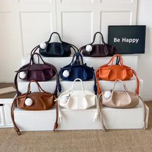 Womens soft leather cloud shoulder bag, stylish casual handbag and crossbody bag with plush charm.