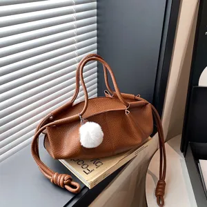 Brown soft leather cloud shoulder bag, stylish casual handbag with fluffy plush pendant detail.