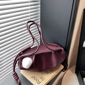 Burgundy soft leather shoulder bag for women, chic knotted handle cloud bag commuter style.
