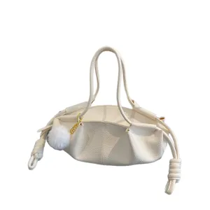 Chic white soft leather shoulder bag, trendy cloud design with plush charm for daily commute.