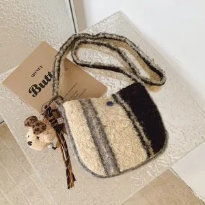 Chic fluffy crossbody bag with cute bear charm and retro striped pattern, ideal for daily wear.