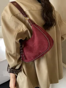 Stylish burgundy suede shoulder bag for women, trendy crescent underarm design daily chic.