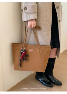 Vintage brown large capacity tote bag for women, stylish PU leather shoulder bag for commute.