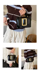 Trendy black patent leather handbag with a vintage gold square buckle detail for women.
