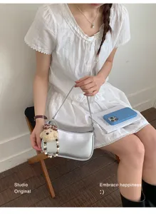 Minimalist silver underarm shoulder bag for women fashion casual daily commute crossbody purse.