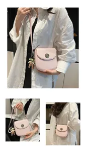 Close-up detail shot of the pink crossbody bag showcasing its chic metal lock and cute pendant.