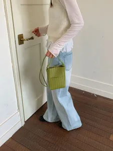 Green woven mini crossbody phone bag for women, stylish chic leather shoulder handbag.