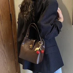 Fashion retro bucket bag for women, trendy chic casual shoulder crossbody bag with cherry charm.
