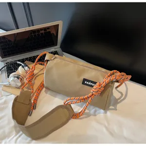 Trendy waterproof cylindrical shoulder bag with colorful rope straps for casual daily use.