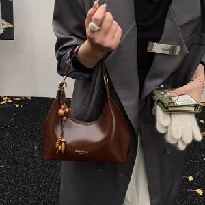 Elegant brown underarm hobo shoulder bag with wooden bead charm for women fashion chic daily use