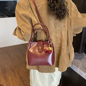 Women Fashion PU Leather Bucket Bag Vintage Retro Shoulder Crossbody Bag With Metal Lock And Cherry Pendant