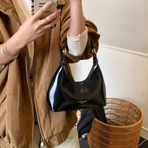 Classic black patent leather underarm bag for women, chic hobo shoulder handbag for daily use.
