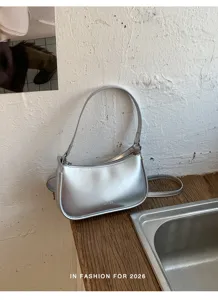 Silver metallic underarm shoulder bag for women, chic trendy casual commuter crossbody purse.