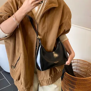 Stylish black patent leather underarm shoulder bag for women, retro chic design, daily use.