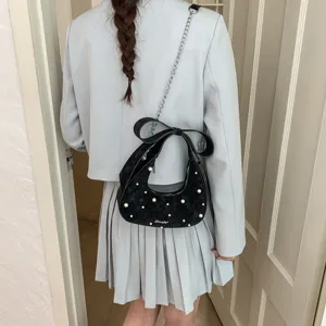 Chic black quilted hobo shoulder bag for women with pearl decor and bow, stylish cross-body bag.