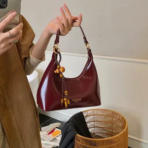 Vintage patent leather hobo shoulder bag with wooden bead tassel charm for women
