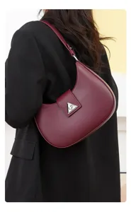 Elegant burgundy crescent shoulder bag for women, stylish hobo purse with triangle metal lock.