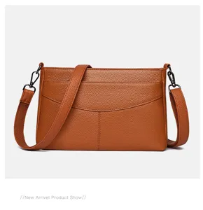 Genuine leather shoulder bag for women, textured brown crossbody handbag with adjustable strap.